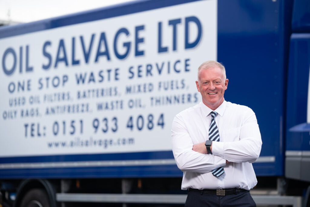 photo of director Vin Vernon in front of one of our vehicles 