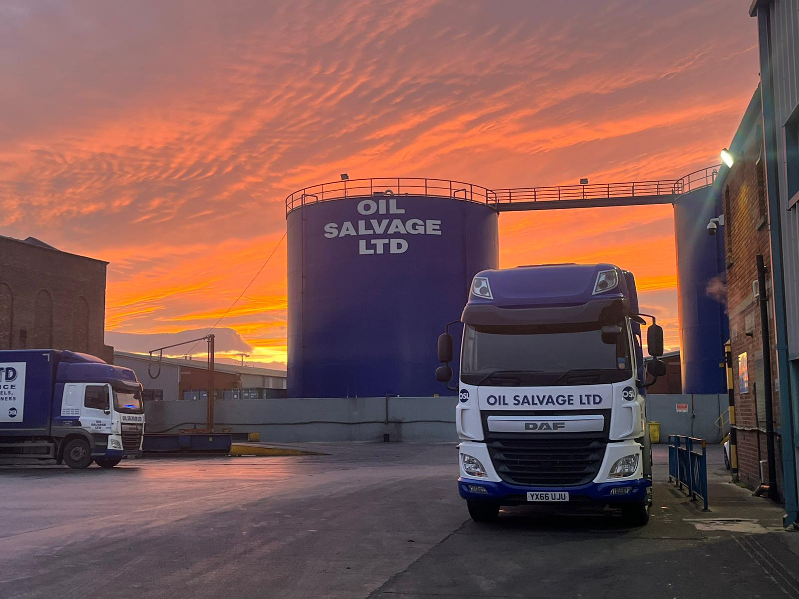 an Oil Salvage truck in our yard in front of a nice sky.
